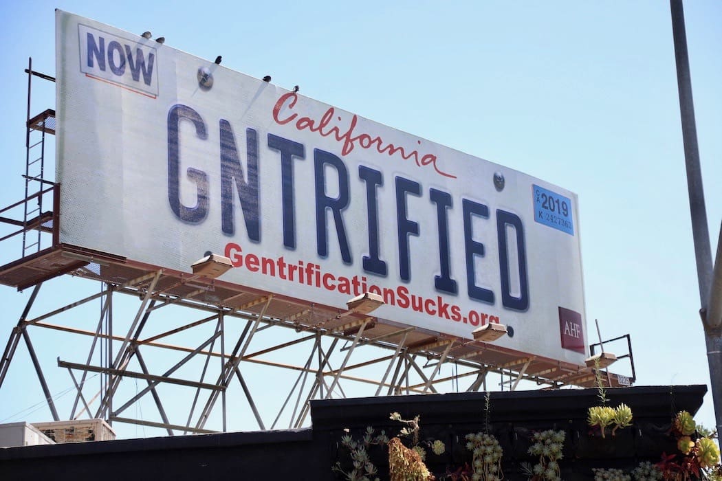 Featured image for “‘GNTRIFIED’ Billboards Hit Inaction on Housing Affordability Crisis”